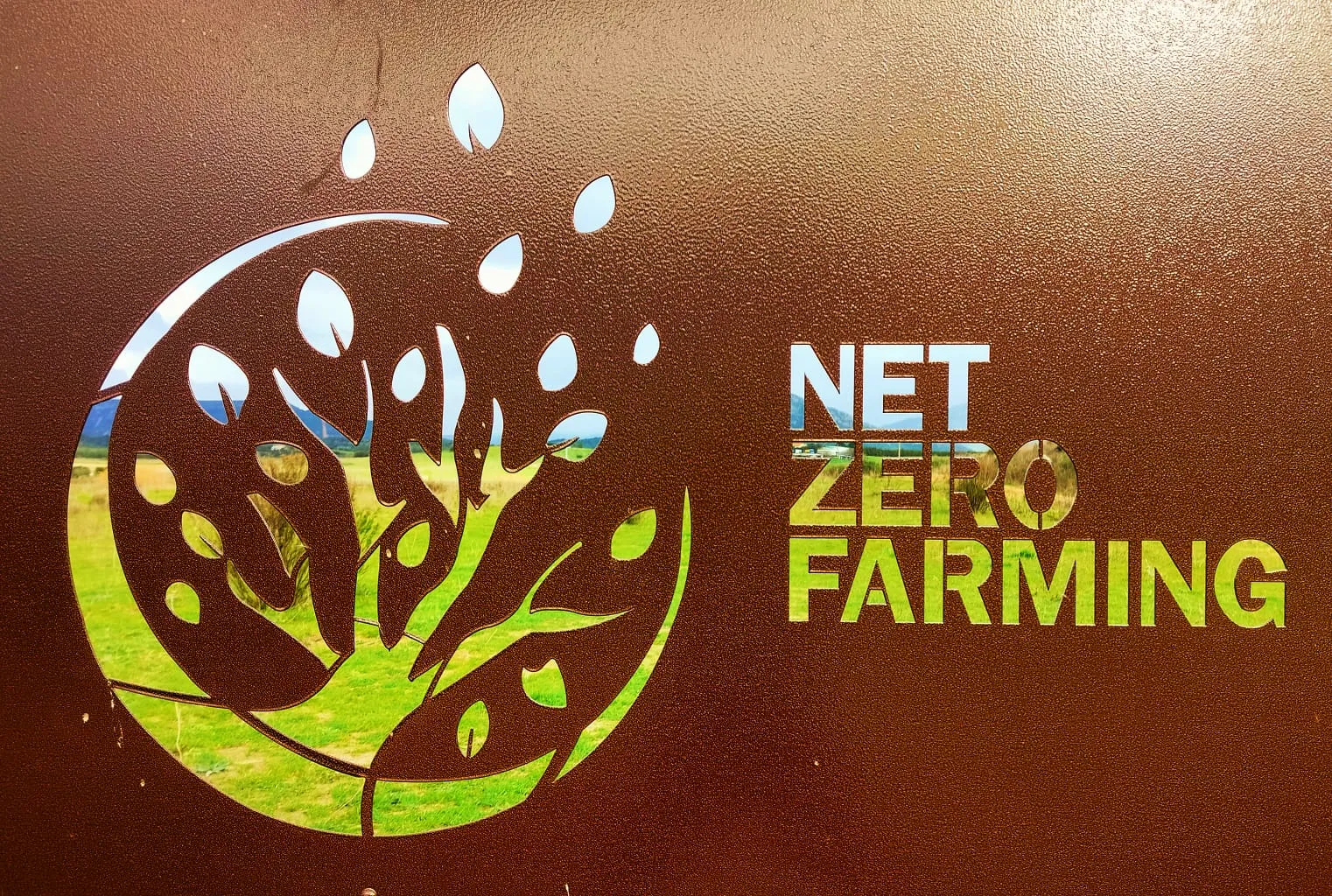 The Net Zero Farming logo laser-cut into the farm’s metal gate.